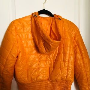 Neon orange puffer jacket